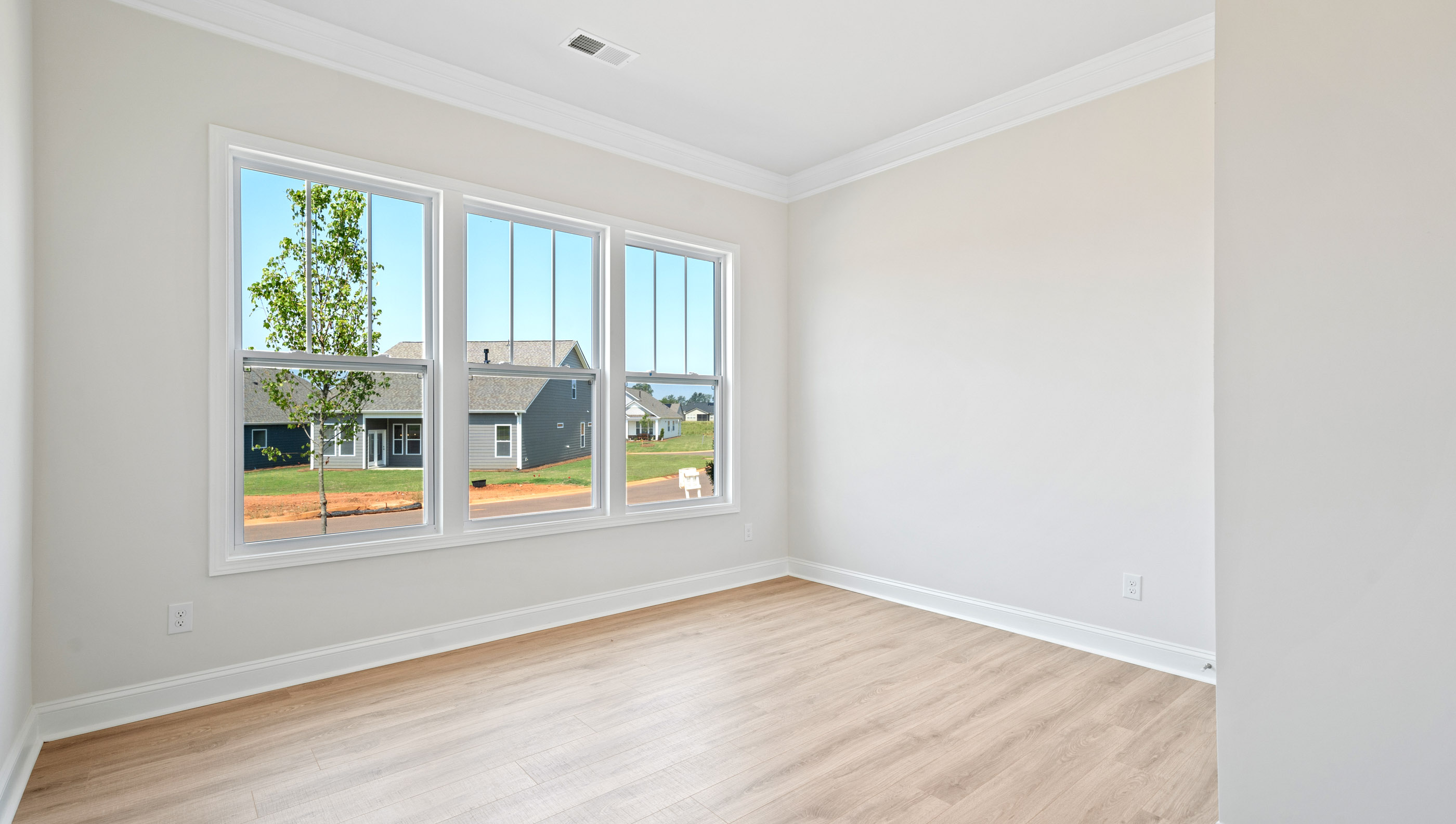 Bedroom with window and closet.