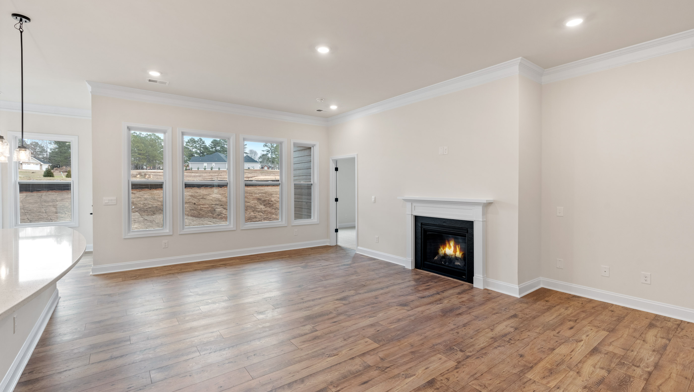 Family room with fireplace and windows.