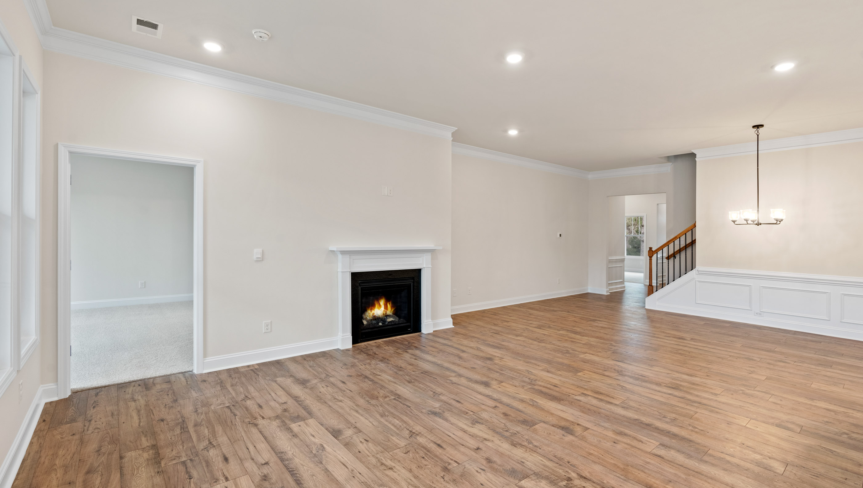 Family room with fireplace and windows.