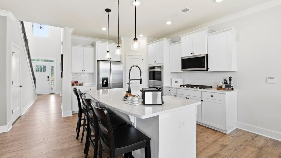 Kitchen with island and cabinets.