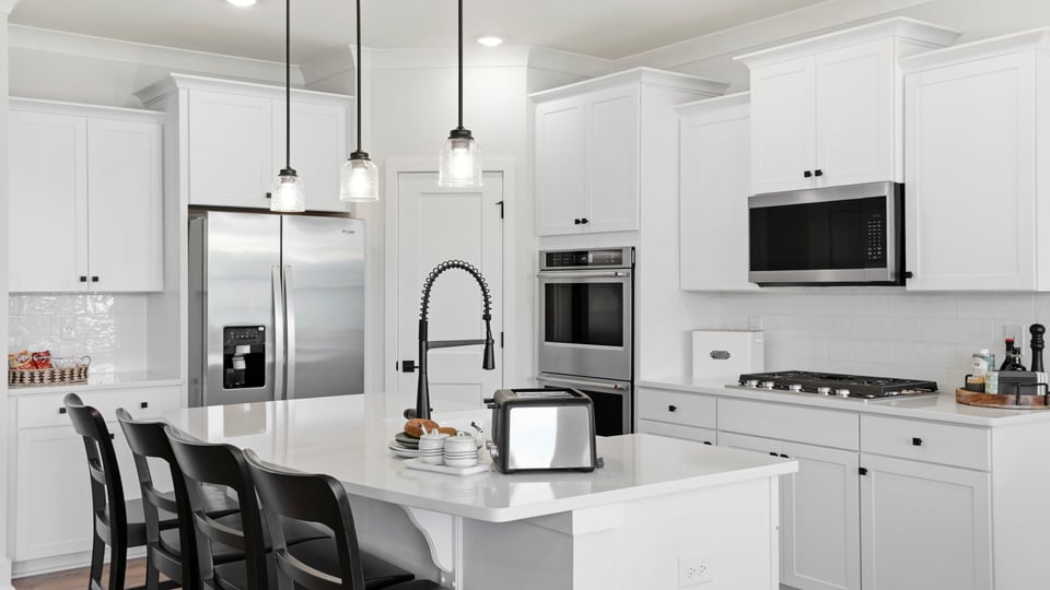 Kitchen with island and cabinets.