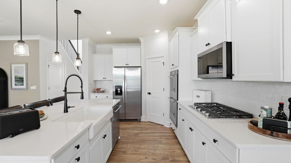 Kitchen with island and cabinets.