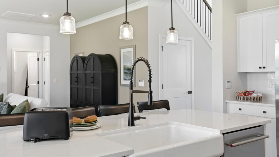 Kitchen with island and cabinets.