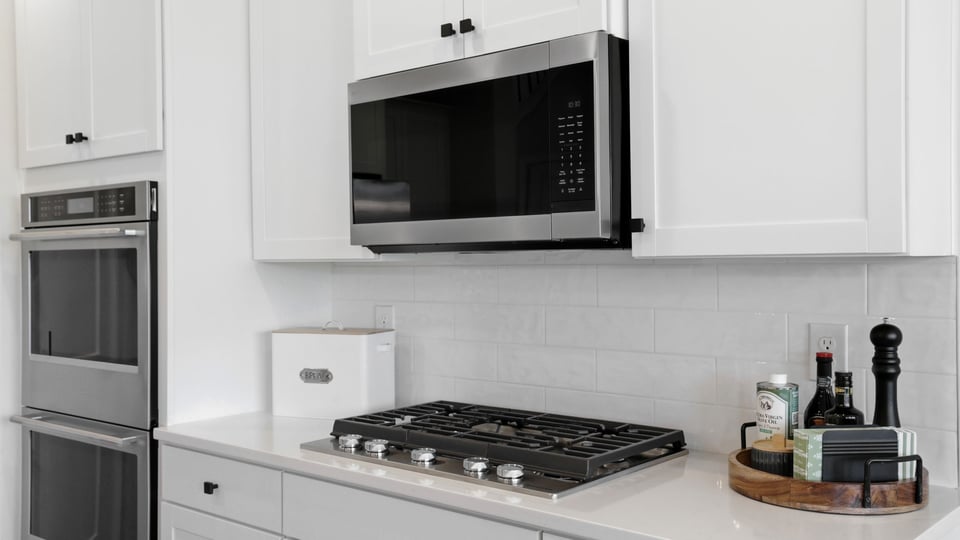 Kitchen with island and cabinets.