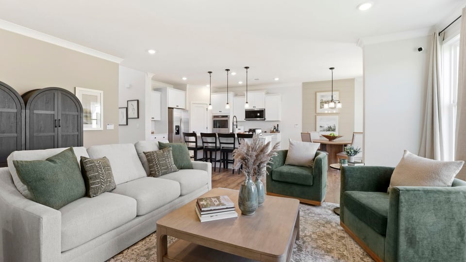 Living room with fireplace and windows.