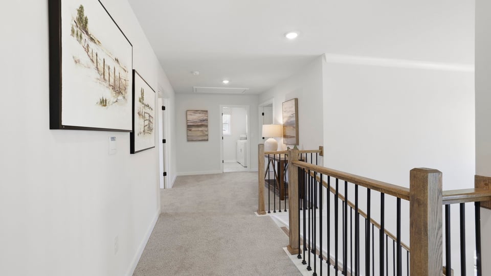 Top of stairs with carpet.
