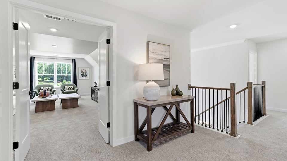 Top of stairs with carpet.