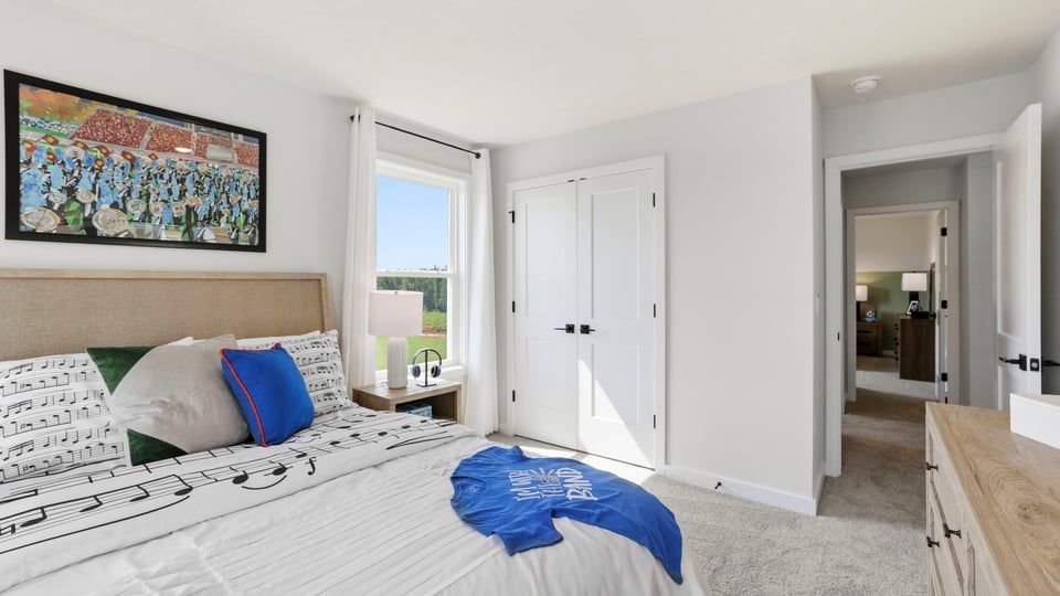 Bedroom with windows and closet.