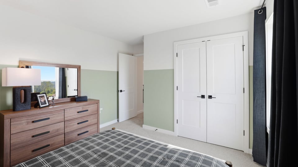 Bedroom with windows and closet.