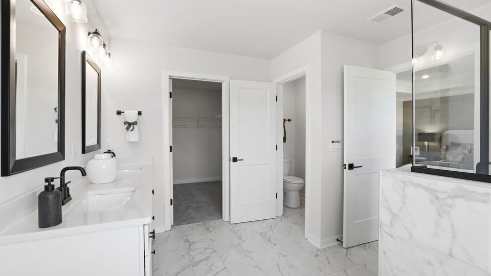 Primary bathroom with double vanity sinks.