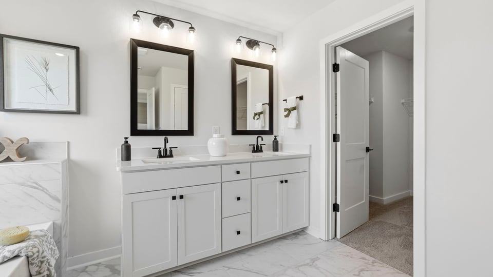 Primary bathroom with double vanity sinks.