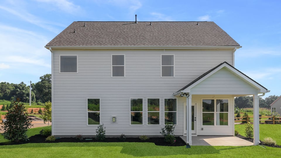 Back exterior with large backyard.