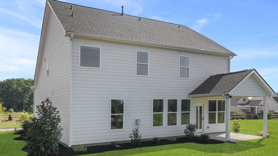 Back exterior with large backyard.