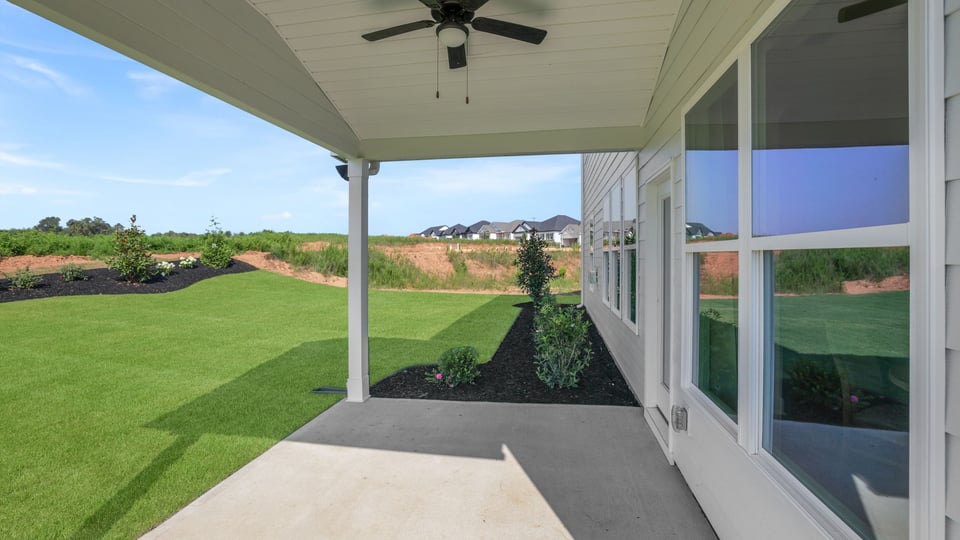 Back exterior with large backyard.