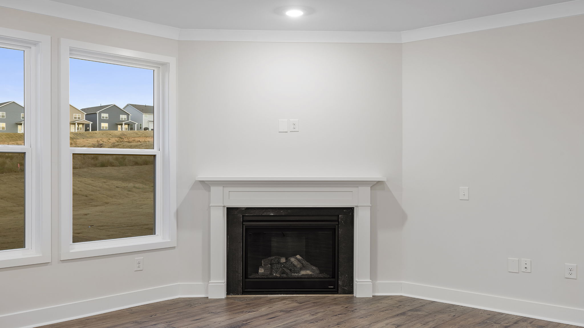 Living area with gas log fireplace.