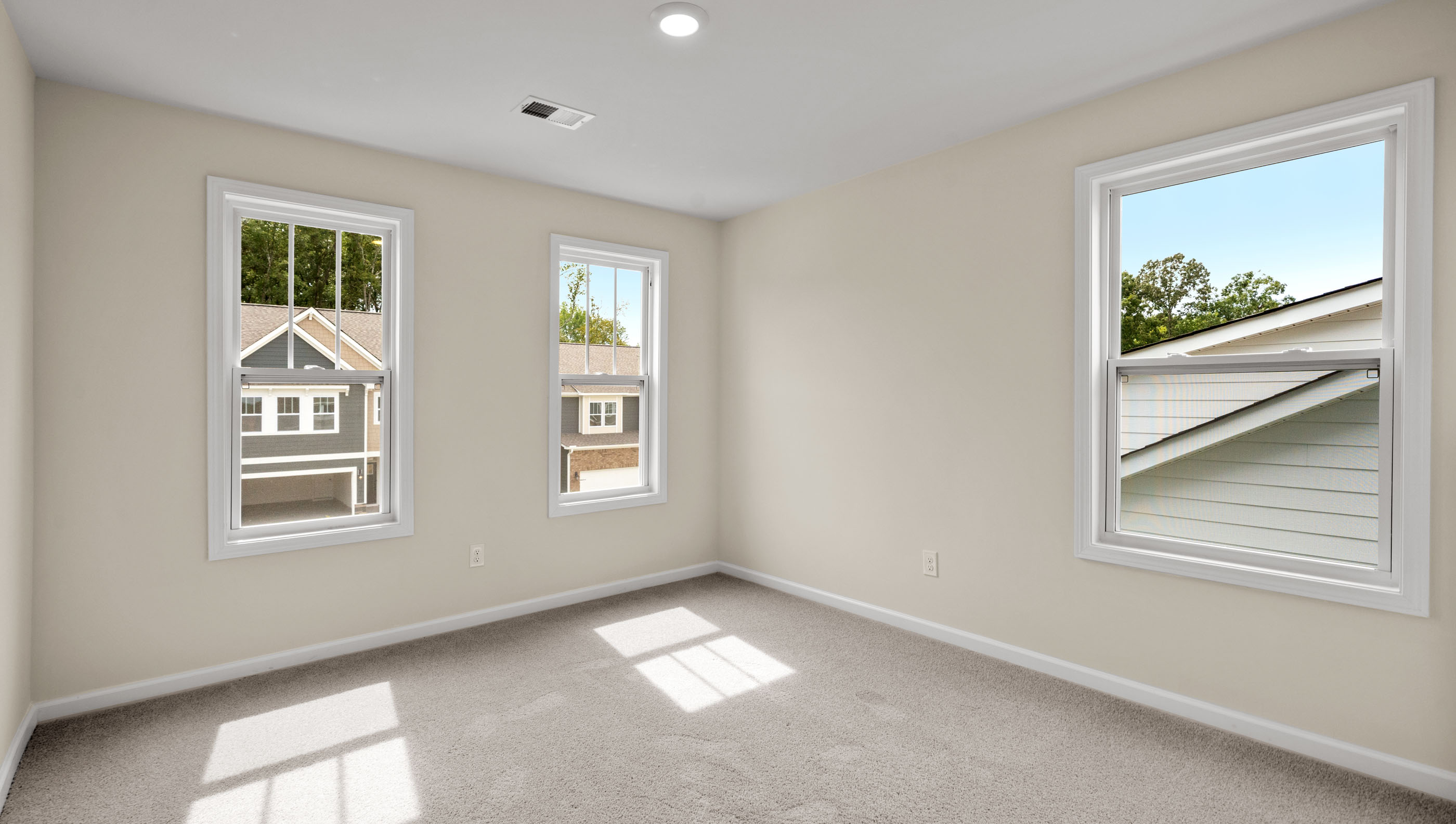 Bedroom with carpet and window.
