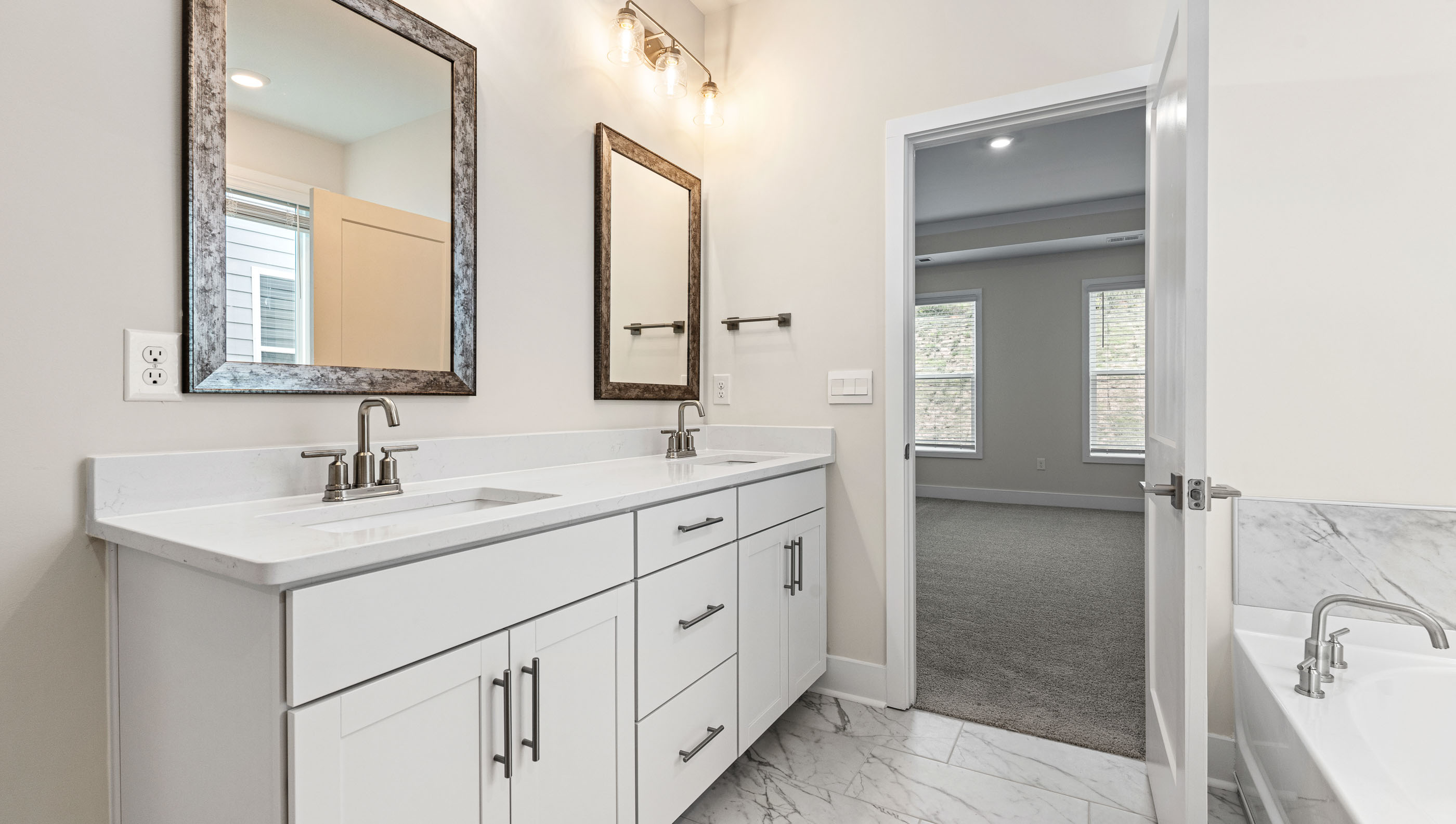 Primary bathroom with dual sink vanity.