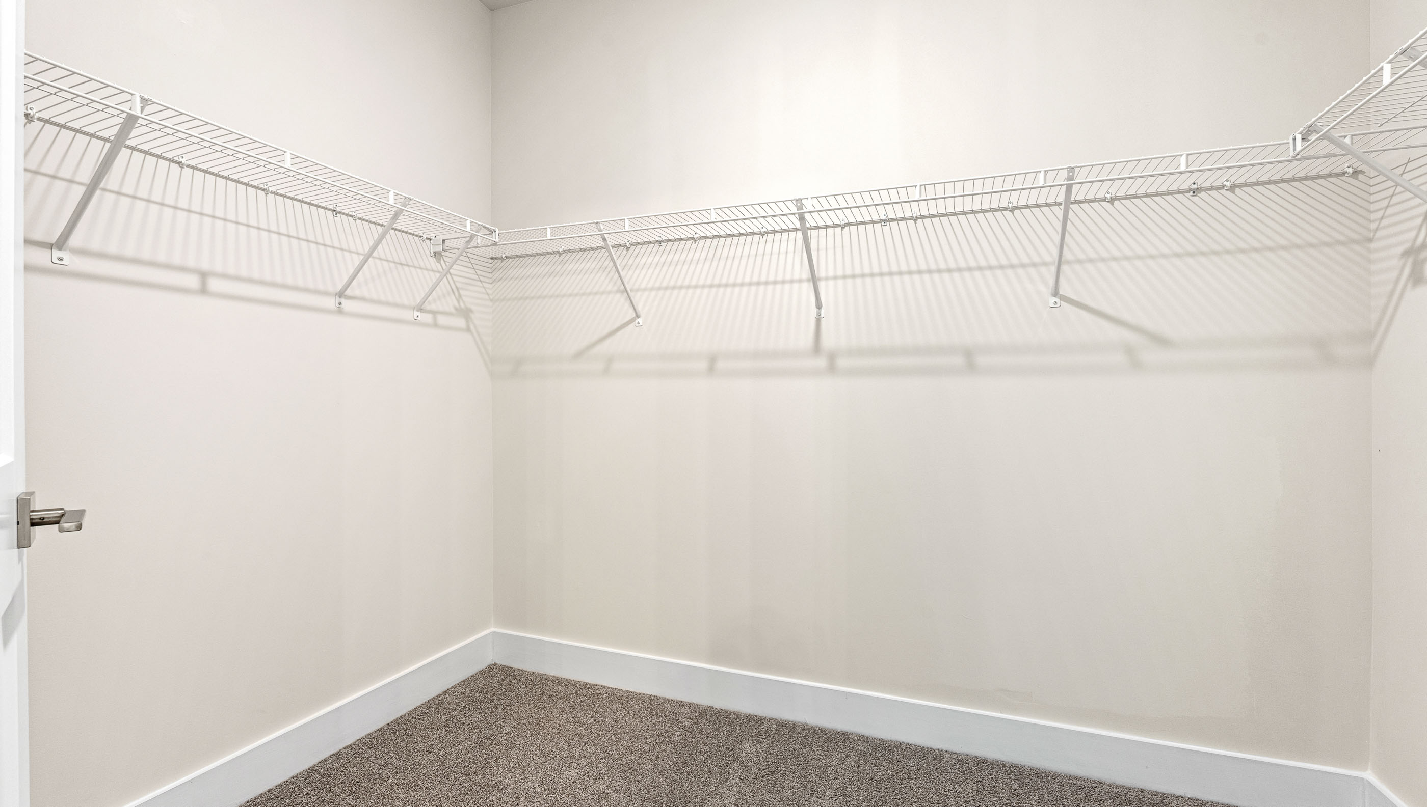 Primary bedroom walk-in closet.