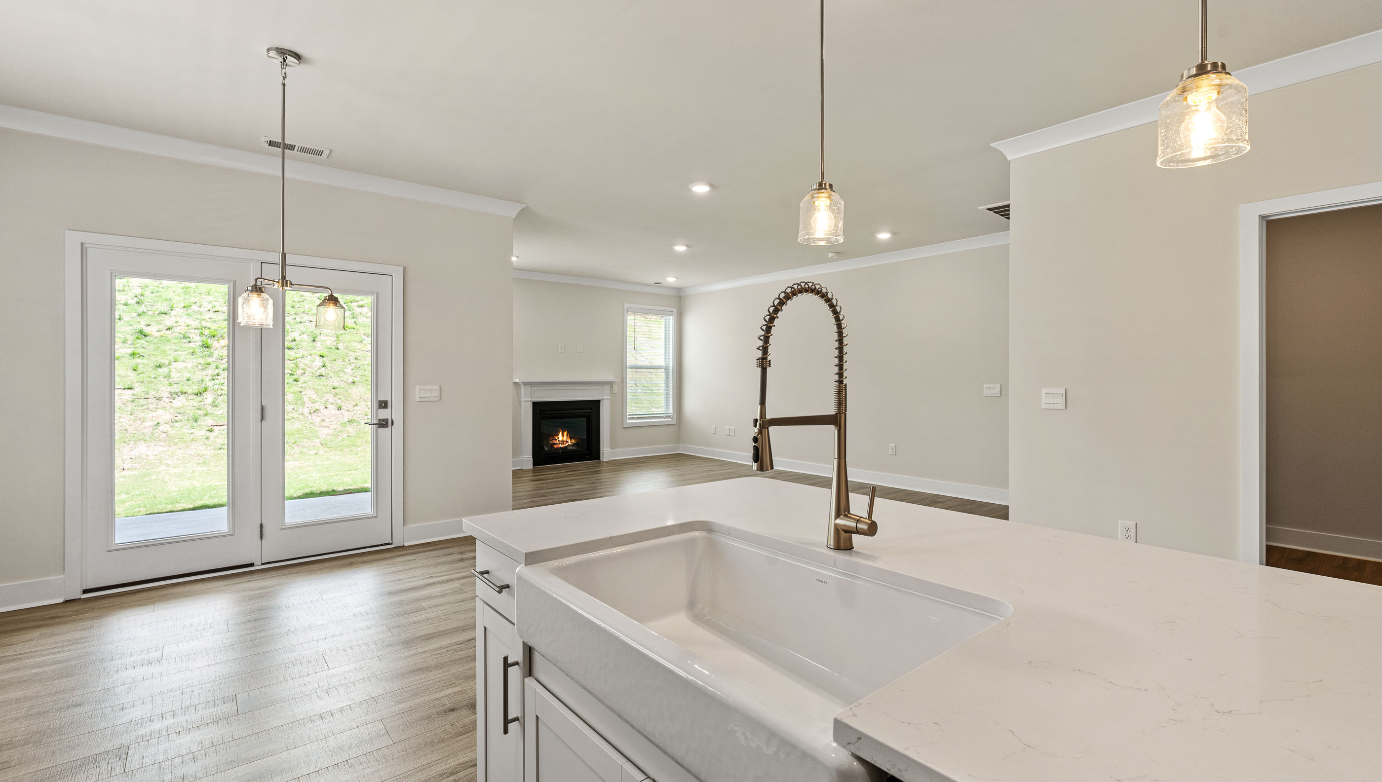 View from kitchen of dining area and nearby family room.