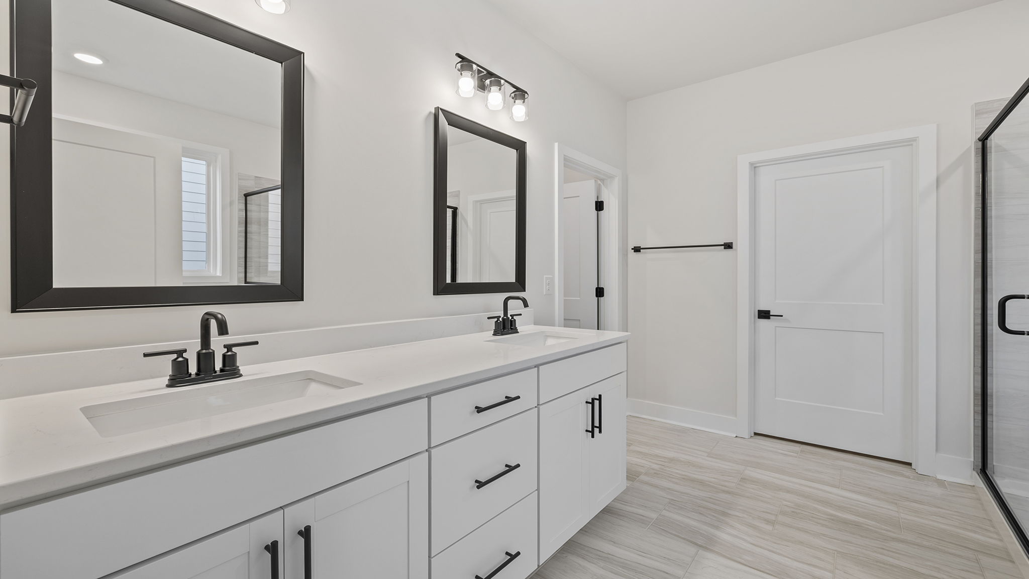 Primary bathroom with dual sink vanity.