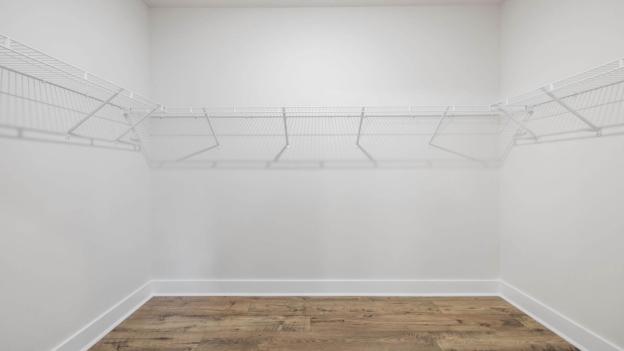 Primary bedroom walk-in closet.