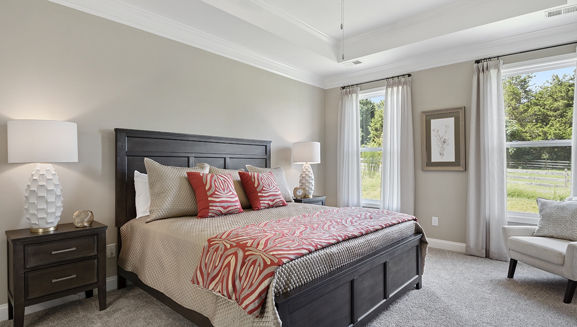 Bedroom with carpet and windws.