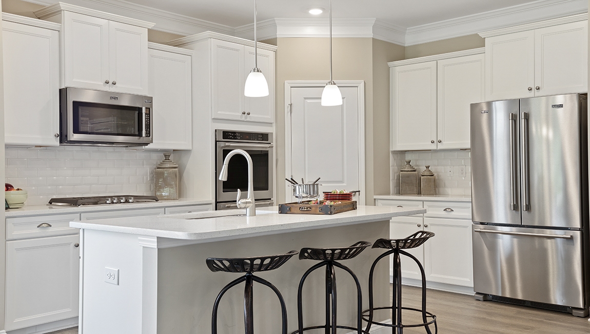 Kitchen and island with granite counter tops.