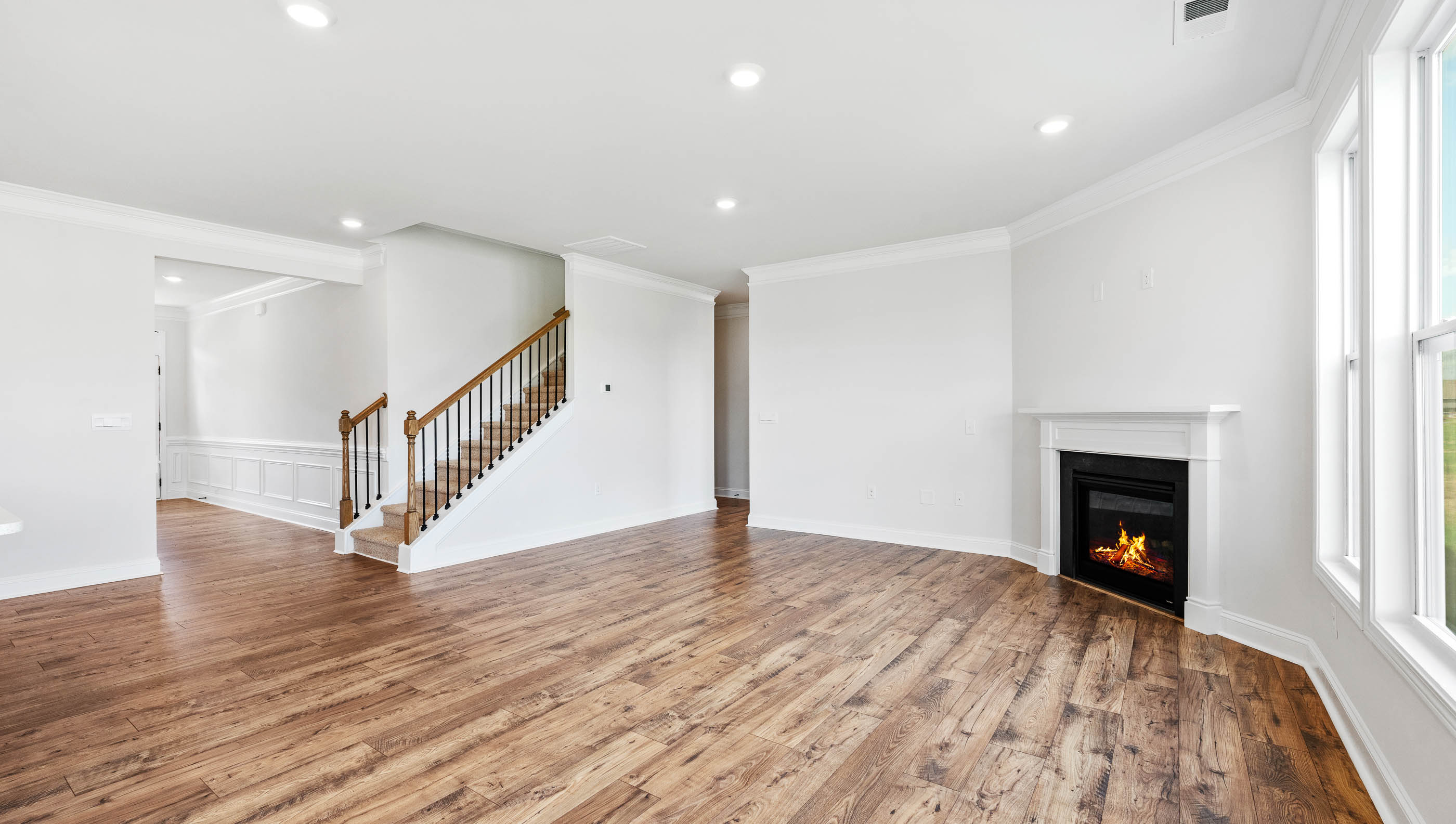 Family room with windows and fireplace.