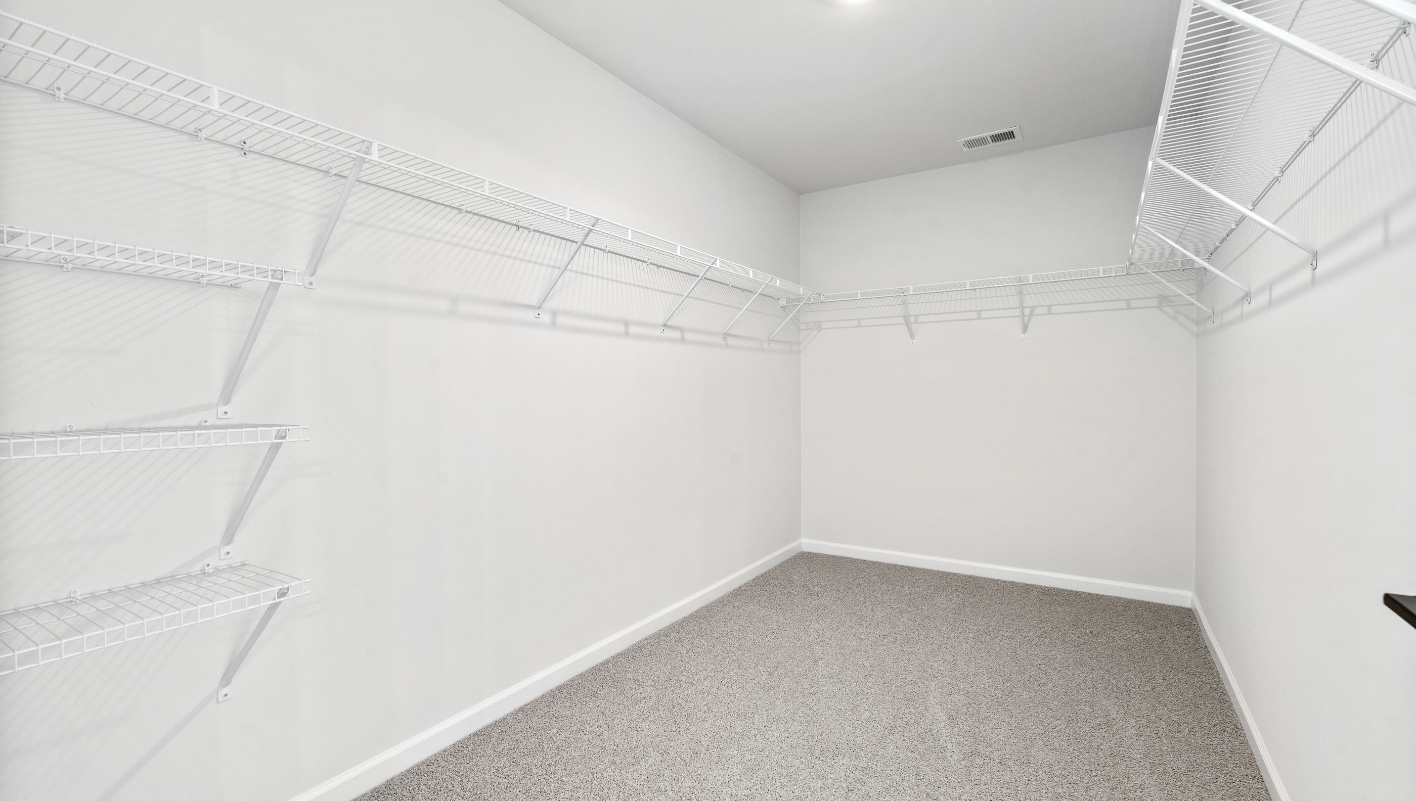 Closet with hanging storage racks.