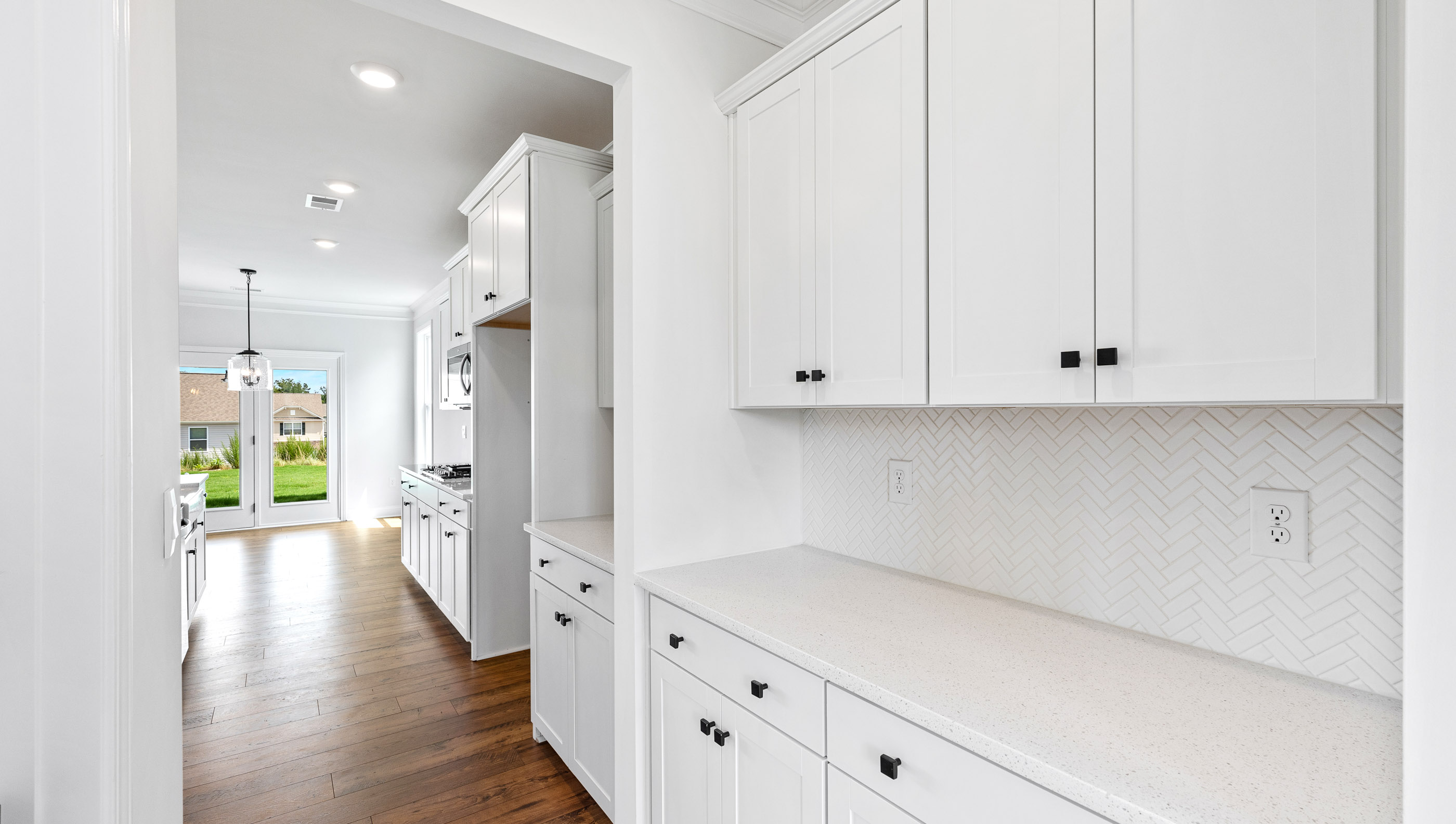 Kitchen and island with granite counter tops.