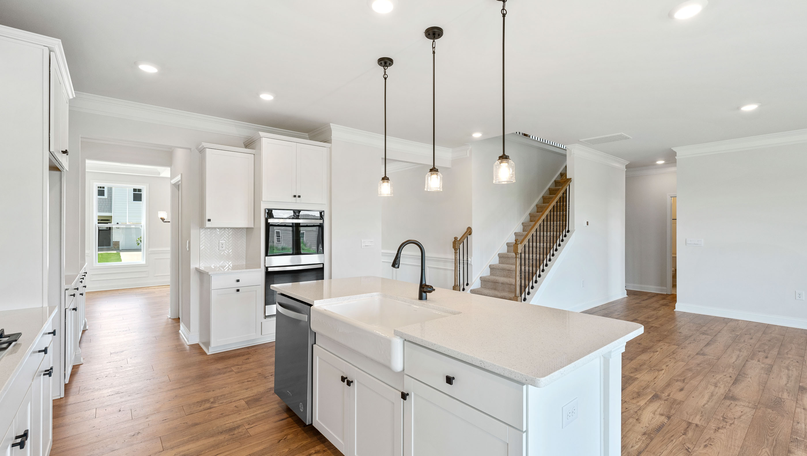 Kitchen and island with granite counter tops.