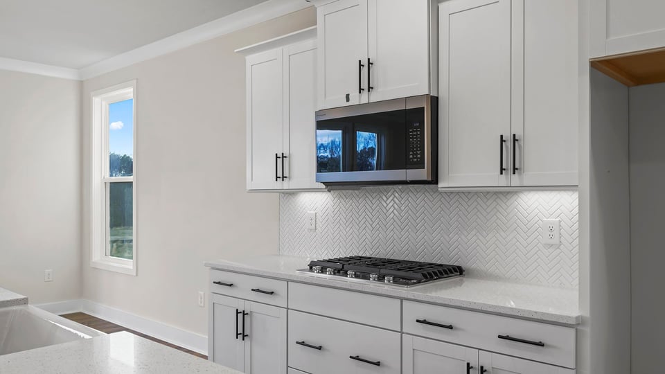 Kitchen with island and cabinets.