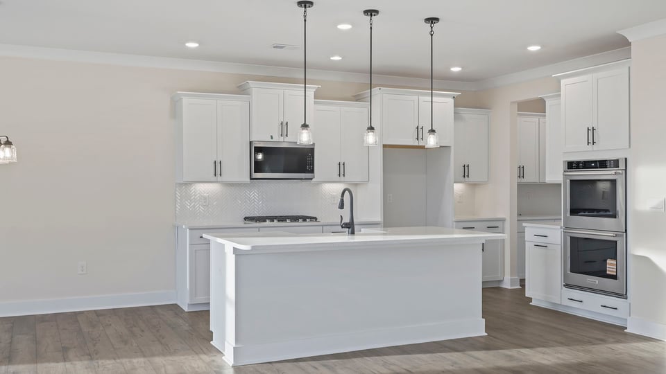 Kitchen with island and cabinets.