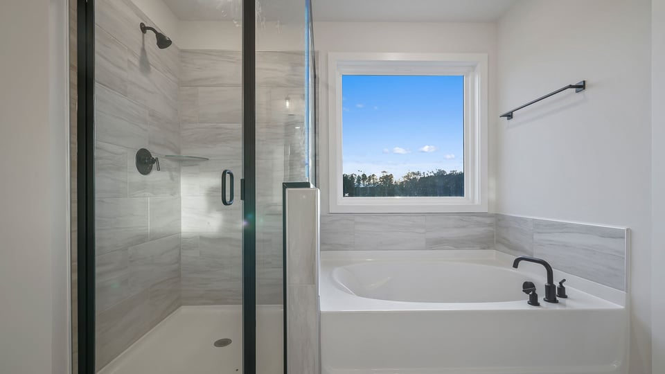 Primary bathroom with double vanity sinks.