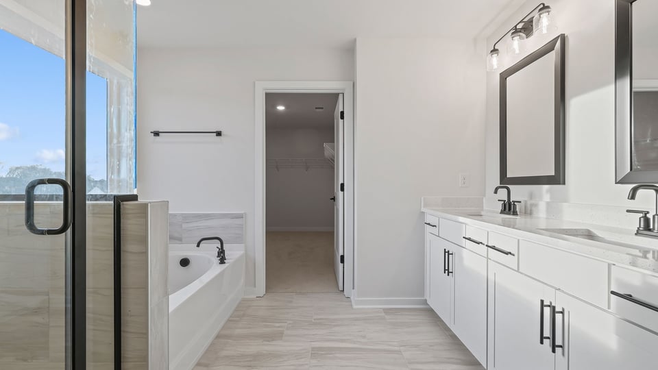 Primary bathroom with double vanity sinks.