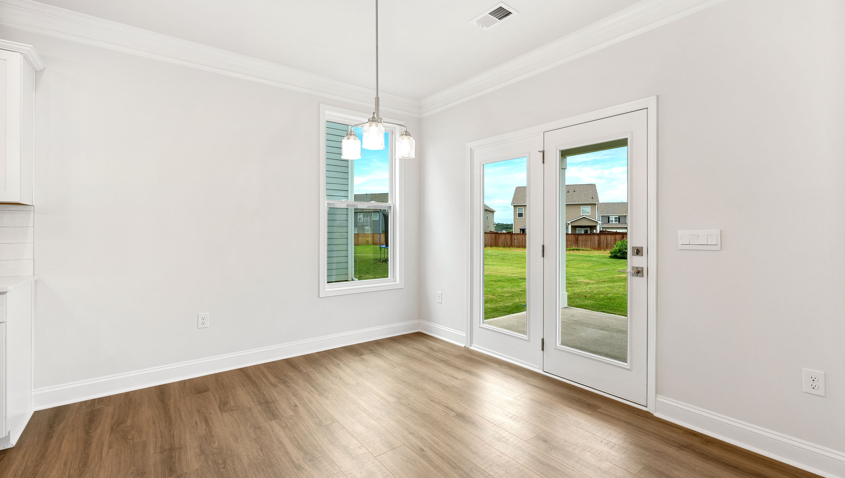 Breakfast area and door to the backyard.