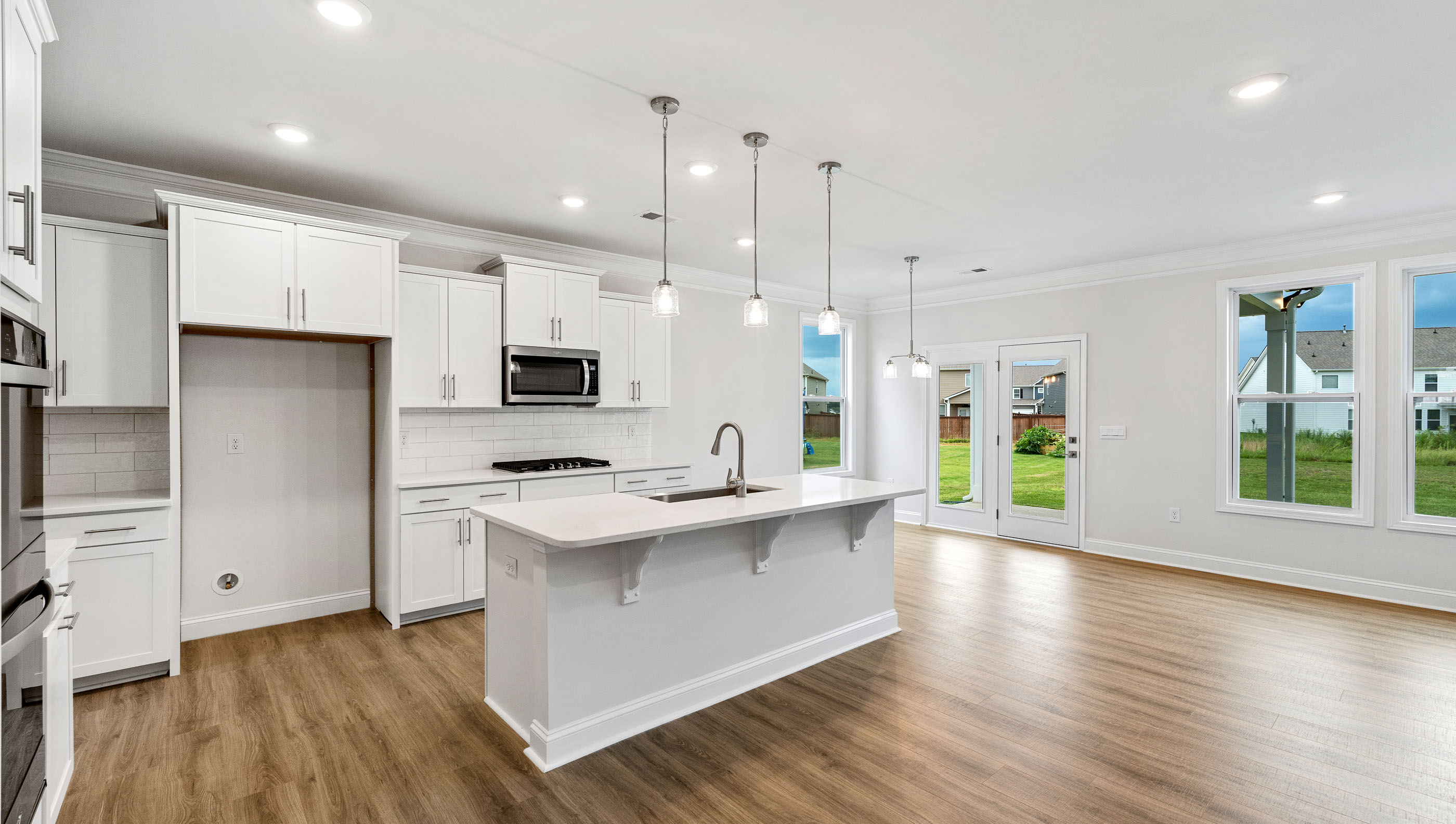 Kitchen open to the breakfast area.