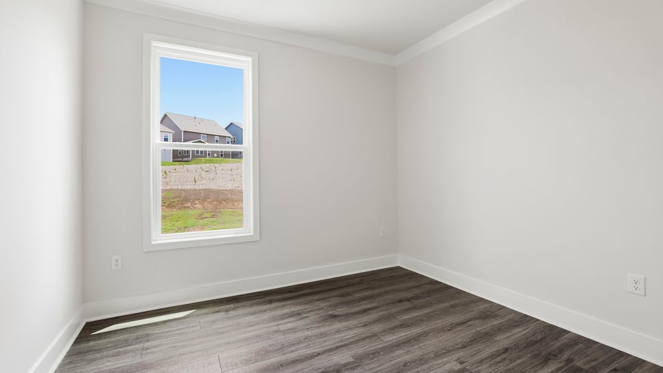Bedroom with window and closet.