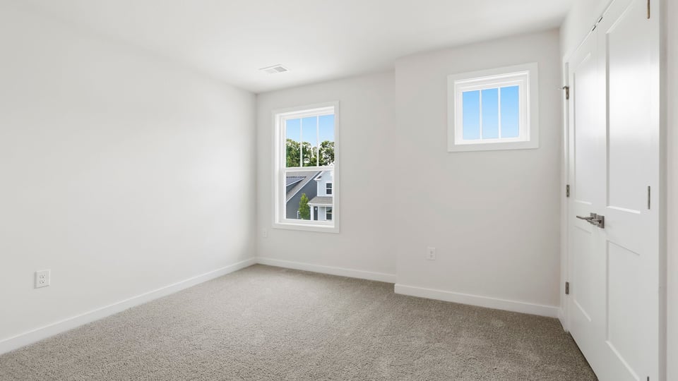 Bedroom with window and closet.