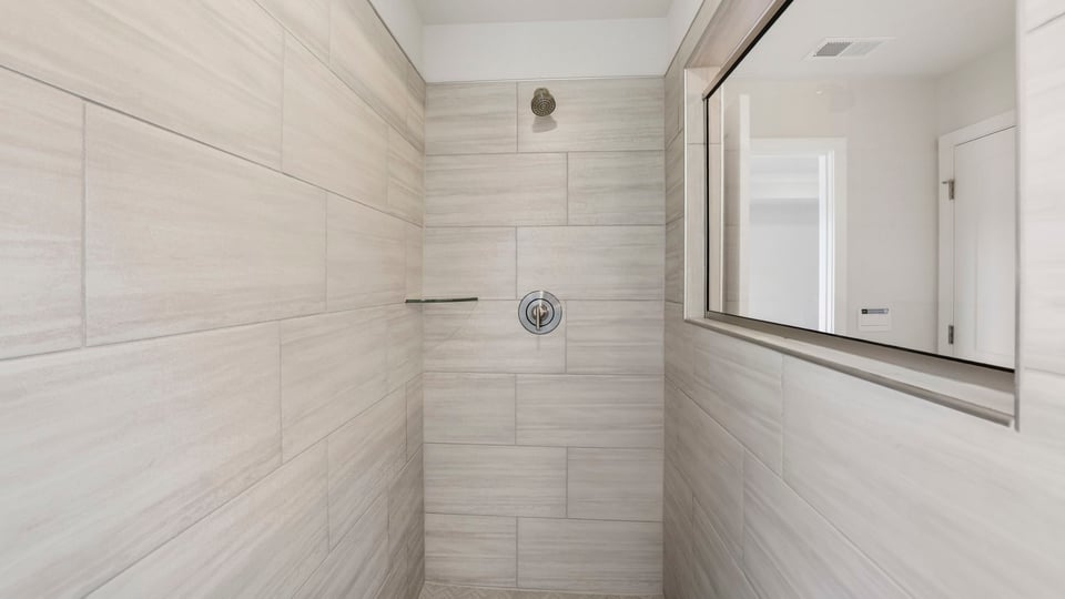 Primary bathroom with double vanity sinks.