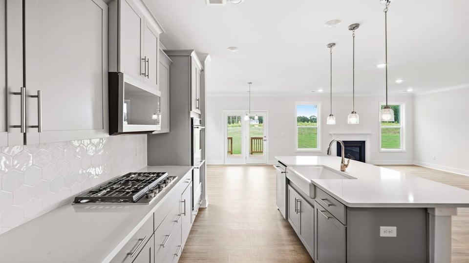 Kitchen with island and cabinets.