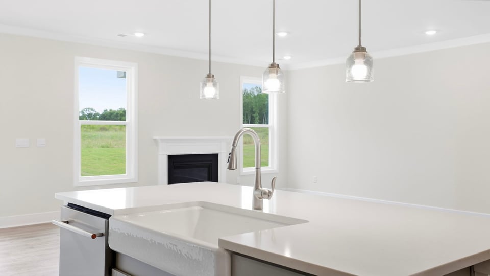 Kitchen with island and cabinets.