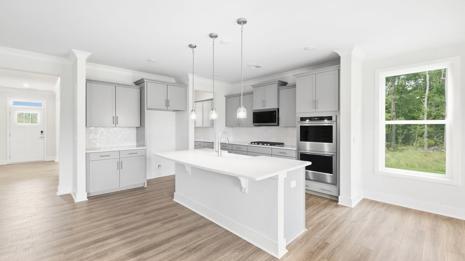 Kitchen with island and cabinets.