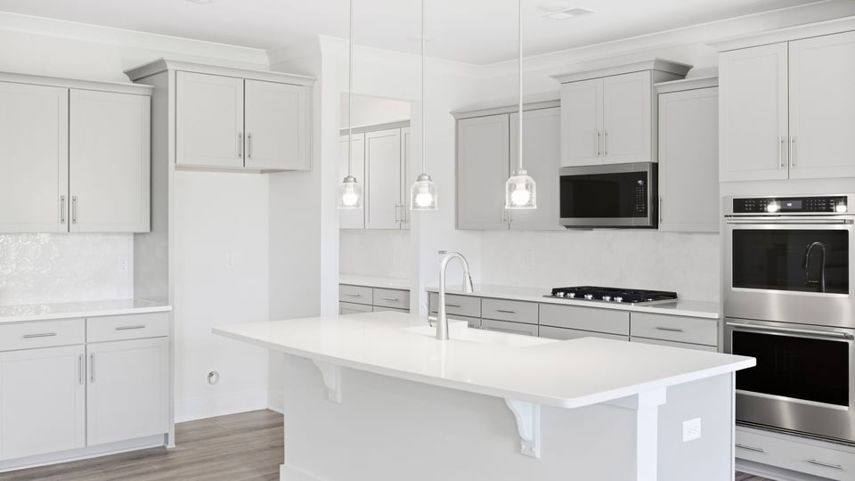 Kitchen with island and cabinets.