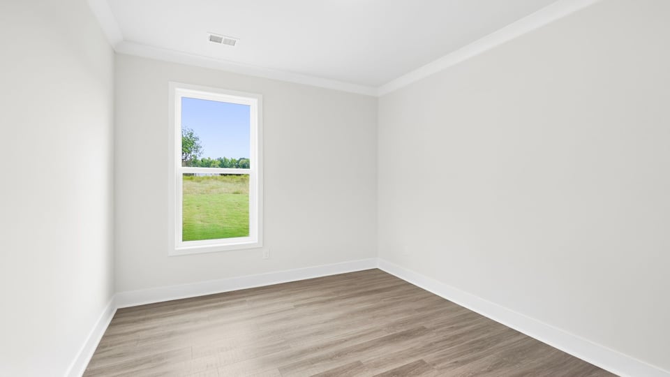 Bedroom with closet and windows.