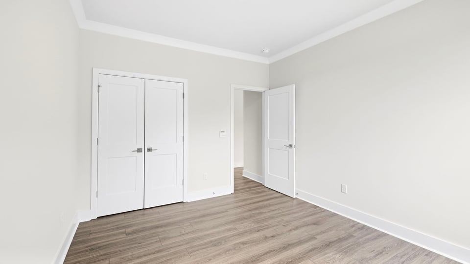 Bedroom with closet and windows.