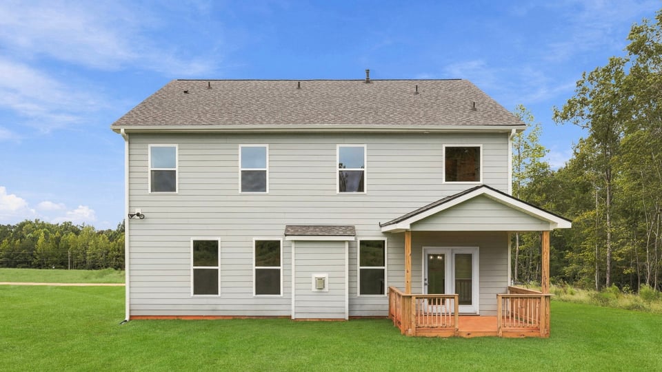 Back exterior with large backyard.