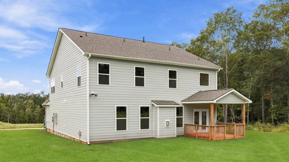 Back exterior with large backyard.