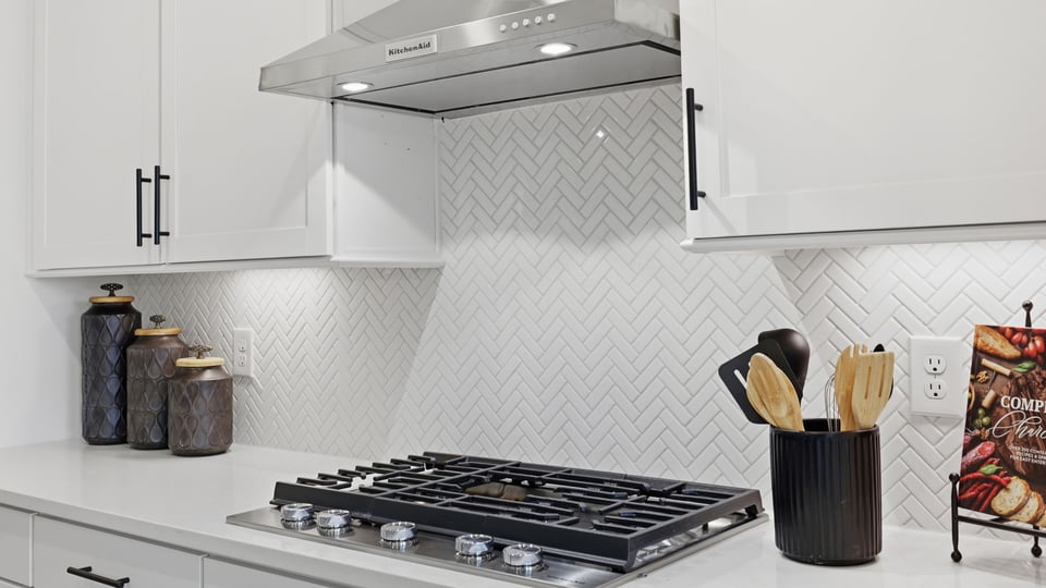 Kitchen with island and cabinets.