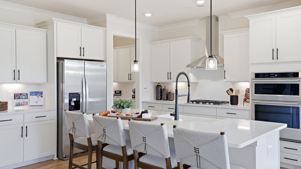 Kitchen with island and cabinets.